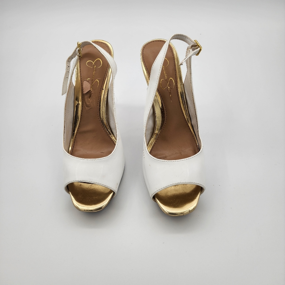 Jessica simpson Shoe white, with open toe and back straps. Minor scratches.